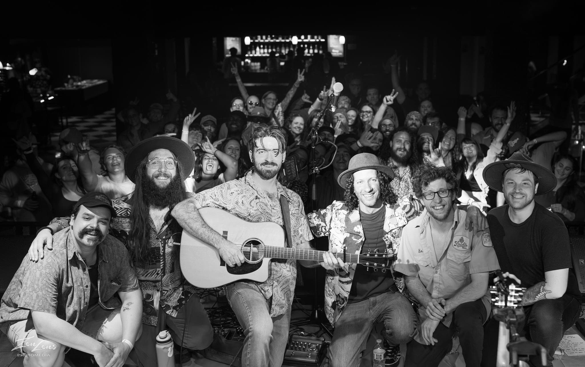 Charlie Mellinger with band and energetic crowd